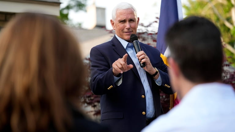 Former Vice President Mike Pence speaks to local residents during...