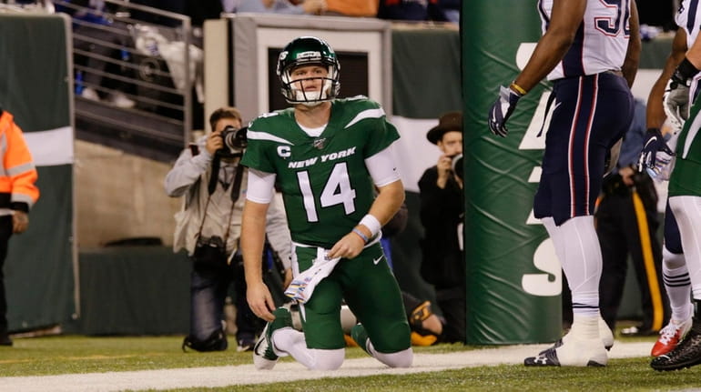 New York Jets quarterback Sam Darnold (14) reacts after the...
