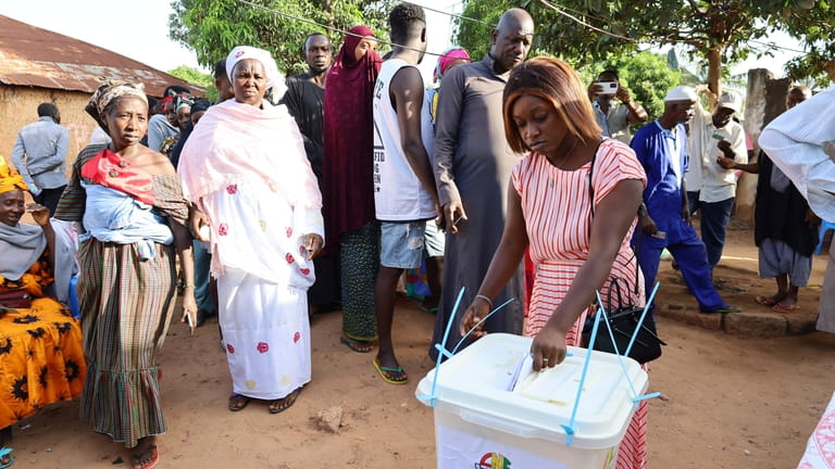 People line up to cast their ballots in Guinea-Bissau's legislative...