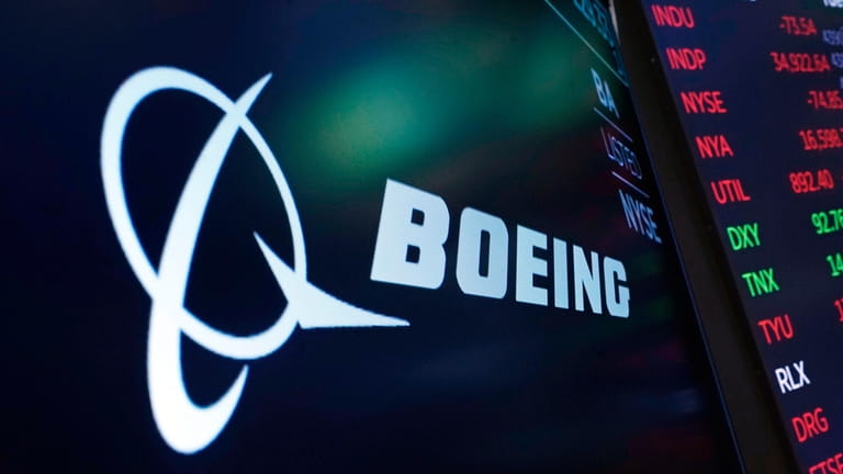 The logo for Boeing appears on a screen above a...