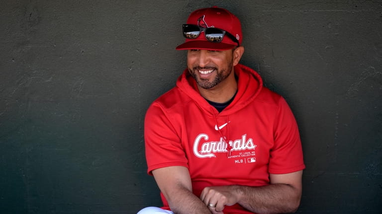 St. Louis Cardinals manager Oliver Marmol sits in the dugout...