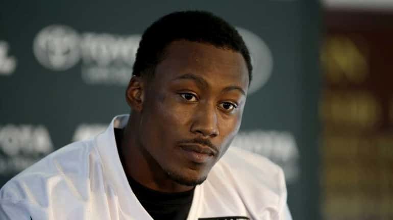 Wide receiver Brandon Marshall gives a press conference after an...
