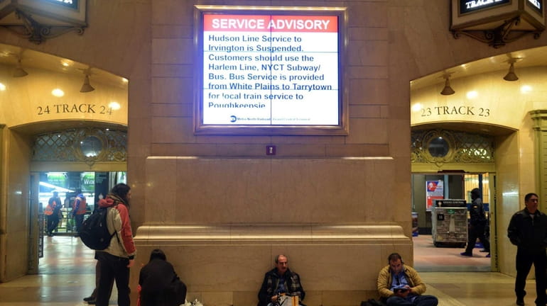 Commuters at Grand Central Station attempt to find an alternate...