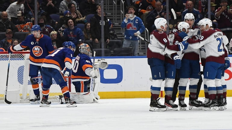 Islanders goaltender Semyon Varlamov and teammates react as Colorado Avalanche...