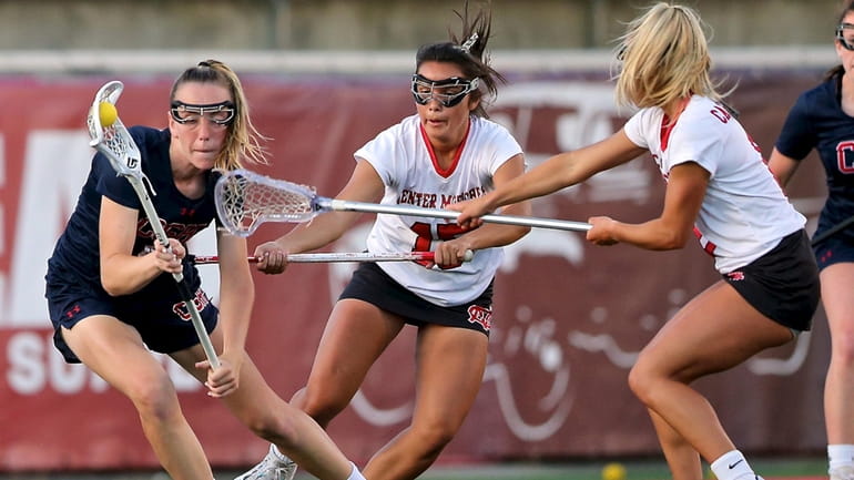 Cold Spring Harbor midfield Ava Tighe looks to move past...