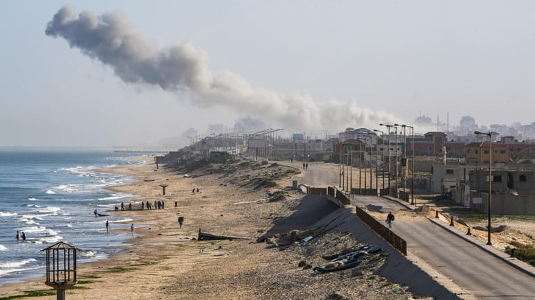 Smoke rises following an Israeli airstrike in the central Gaza...