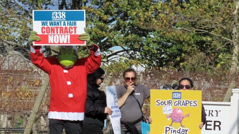 Workers and union officials protested outside Pindar Vineyards on Nov. 12 to...