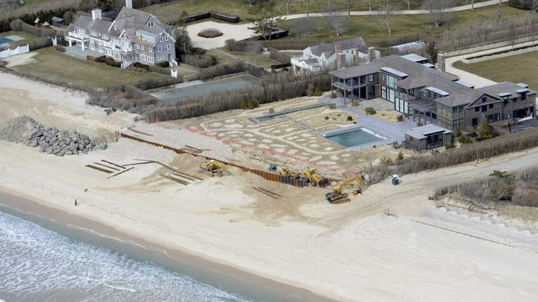 The lawsuit calls the structures, buried on the beach behind...