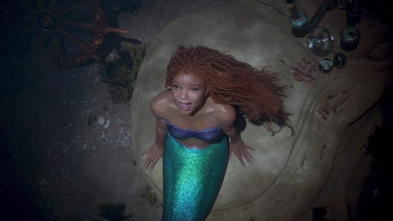 This image released by Disney shows Halle Bailey as Ariel...