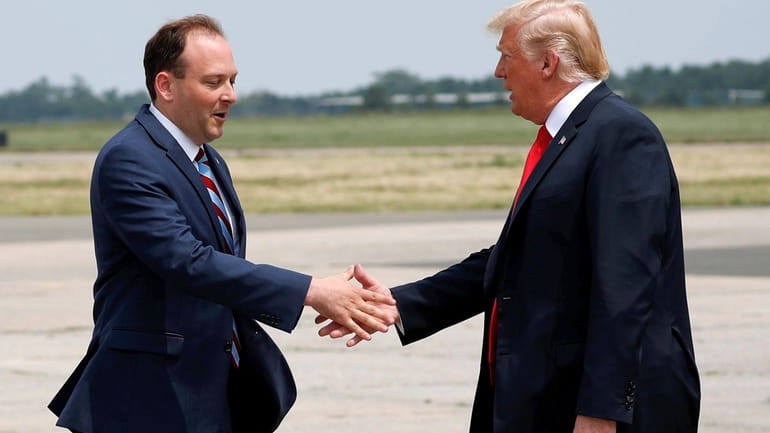 Rep. Lee Zeldin (R-Shirley) greets then-President Donald Trump at Francis...