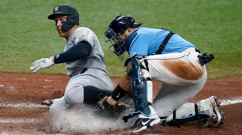Aaron Judge is thrown out at home as Rays catcher...