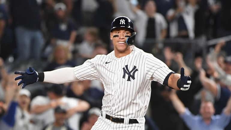 Yankees' Aaron Judge reacts after his walk-off game-winning single against...