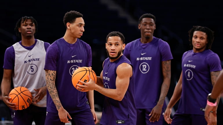 Kansas State guard Markquis Nowell, front center, practices before a...
