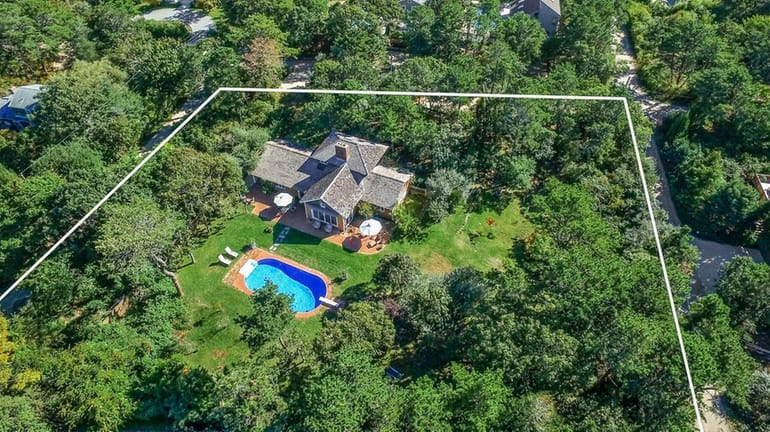 Set on nearly three-quarters of an acre, this Amagansett Dunes...