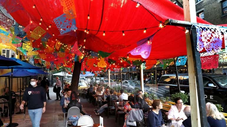 Diners outside in Brooklyn Tuesday. A report from the state...