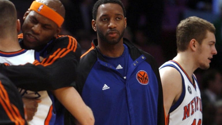 New York Knicks #3 Tracy McGrady, center, walks on the...