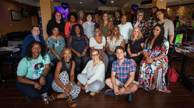 Women's Diversity Network's members pose for a group shot at...