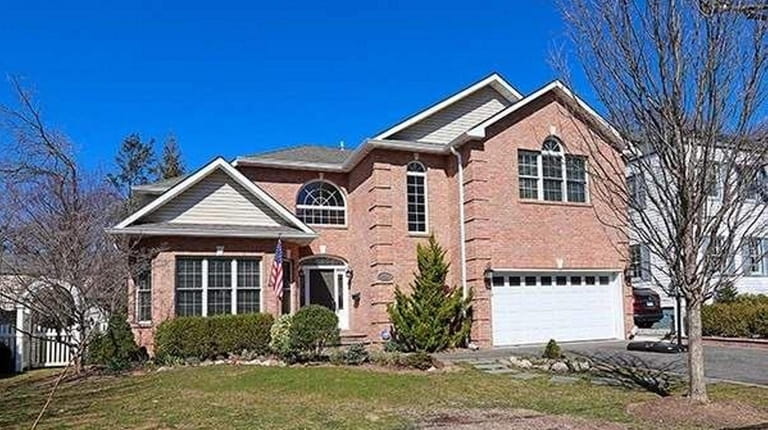 Priced at $999,990, this five bedroom, 2½-bathroom brick Colonial on...
