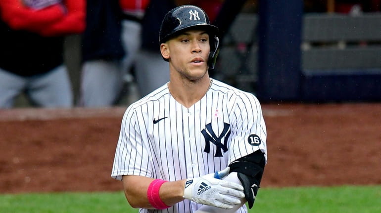 Aaron Judge of the Yankees reacts after drawing a walk against...
