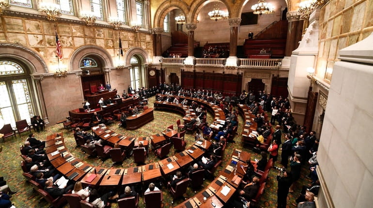 New York state Senate members meet in the Senate Chamber...