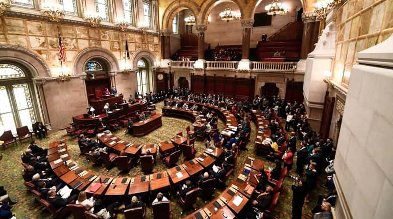 New York state Senate members meet in the Senate Chamber...