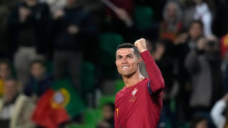 Portugal's Cristiano Ronaldo celebrates after scoring his side's fourth goal...