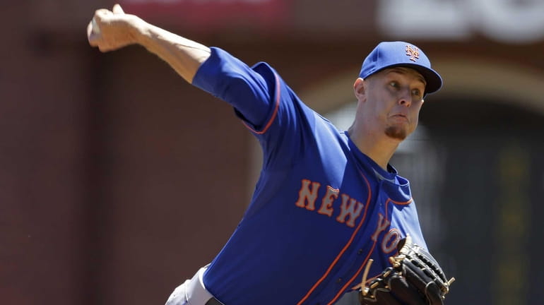 Zack Wheeler delivers a pitch during the first inning of...