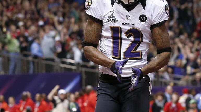 Baltimore Ravens wide receiver Jacoby Jones celebrates his touchdown during...