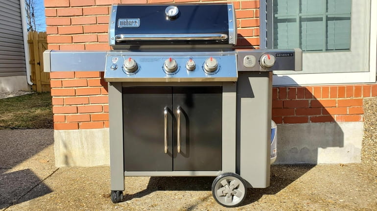 The Weber Genesis II E-335 gas grill comes with a...