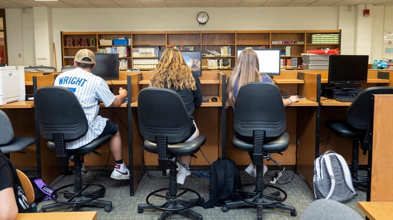 Students do schoolwork in the library at Patchogue-Medford High School on...