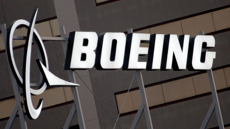 The Boeing logo is seen, Jan. 25, 2011, on the...