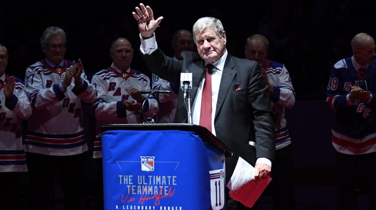 New York Rangers legend Vic Hadfield waves to fans and...