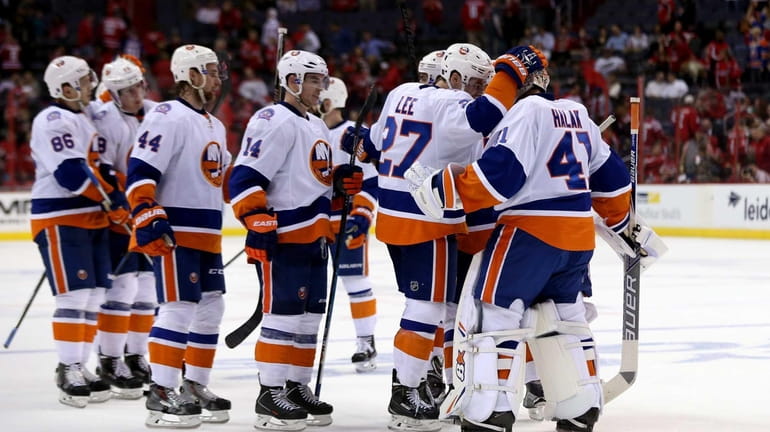 The Islanders celebrate after their 4-1 win over the Washington...