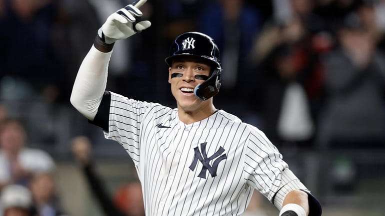 Aaron Judge #99 of the New York Yankees celebrates his...