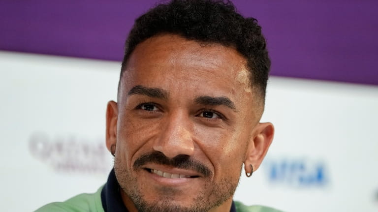 Brazil's Danilo listens to a question during a press conference...