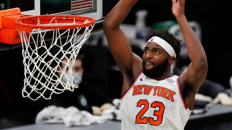 The Knicks' Mitchell Robinson dunks during the second half against...