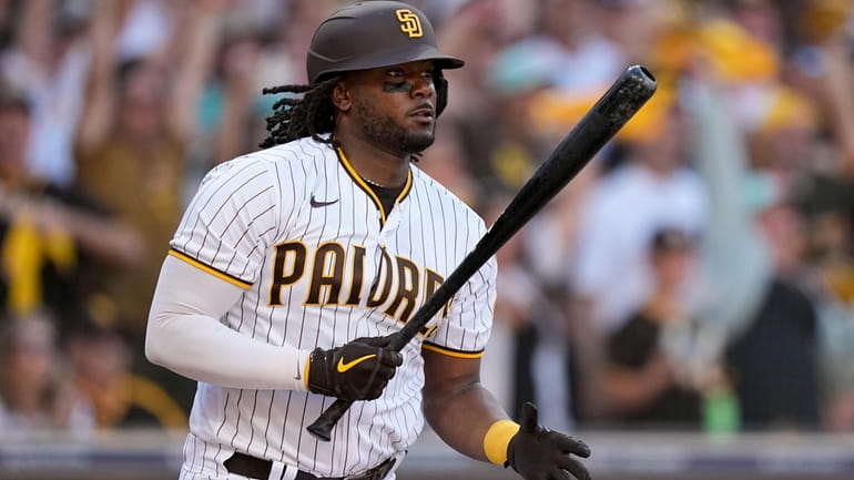 FILE - San Diego Padres' Josh Bell watches hit RBI-single...