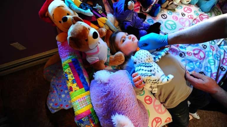 Marisa's girly bedroom, filled with stuffed animals, has become like...