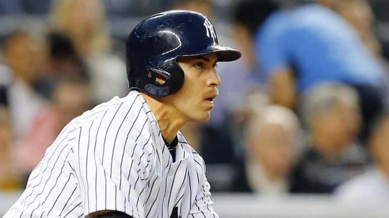 Jacoby Ellsbury of the Yankees follows through on a third-inning...