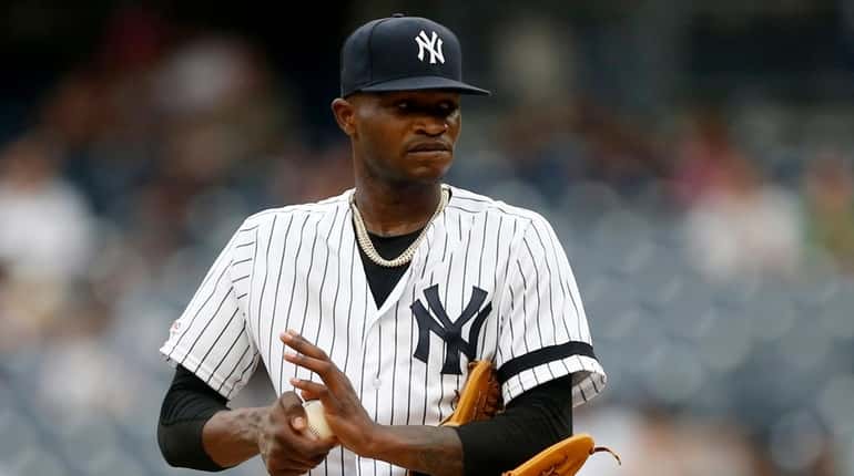 Domingo German of the Yankees stands on the mound during...