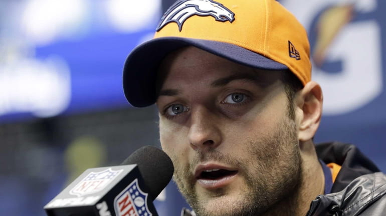 Denver Broncos' Wes Welker answers a question during media day...