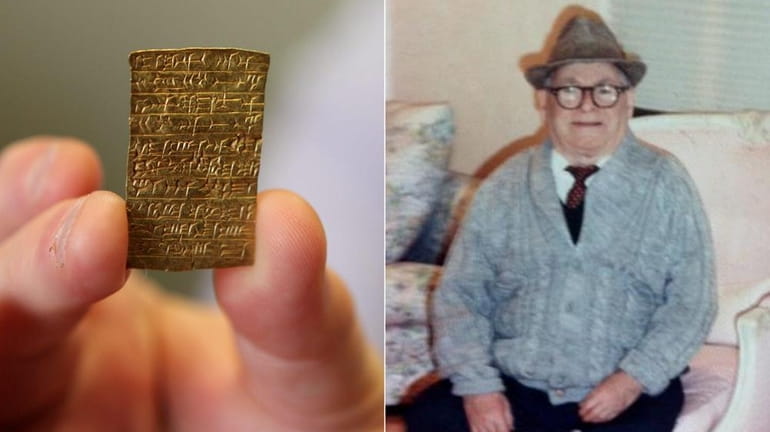 (L-R) Attorney Steven Schlessinger holds an ancient Assyrian gold tablet,...