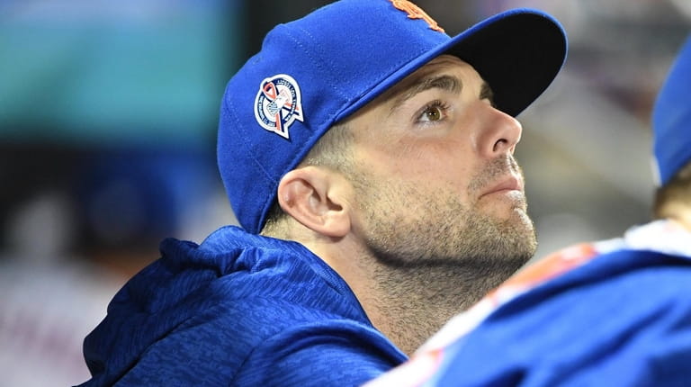 New York Mets' David Wright looks on from the dugout...