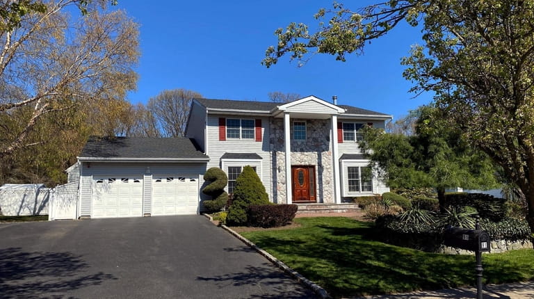 Priced at $920,000, this five-bedroom, 3½-bathroom Colonial on Caramel Road in...