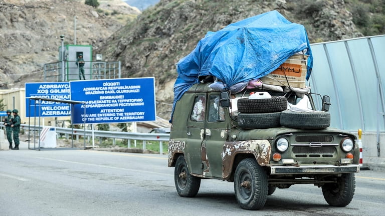 FILE -Sergey Astsetryan, an ethnic Armenian resident of Nagorno-Karabakh, drives...