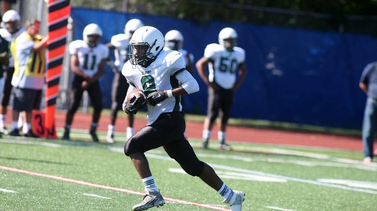 Elmont wide receiver Sevin Malcolm scores a touchdown on an...