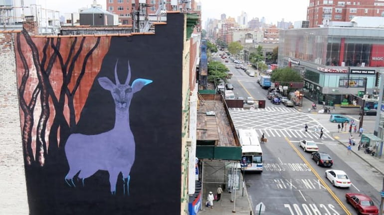 In this Sept. 10, 2015 photo, a large gazelle mural...