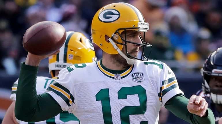 Packers' Aaron Rodgers throws a pass during loss to the Bears on...