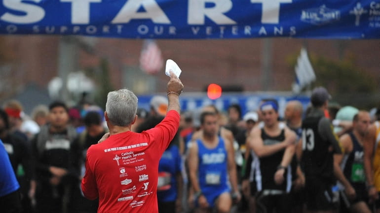 Suffolk County Executive Steve Bellone thanks runners for their support of...