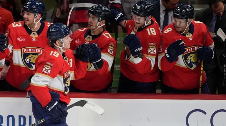 Florida Panthers left wing Matthew Tkachuk (19) is congratulated by...